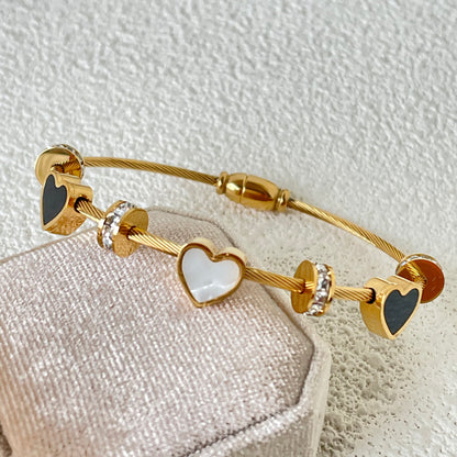 WHITE AND BLACK SHELL HEART BRACELET